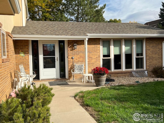 property entrance with a yard