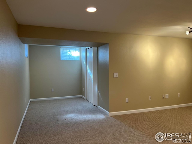 empty room with light colored carpet