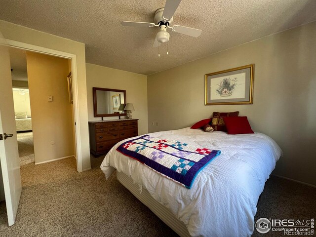 bedroom featuring carpet flooring, a textured ceiling, and ceiling fan