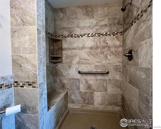 bathroom with tiled shower