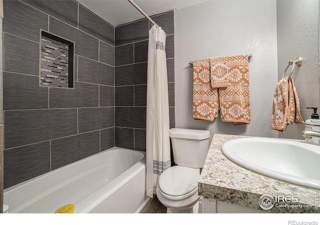 full bathroom with toilet, a textured ceiling, vanity, and shower / bathtub combination with curtain