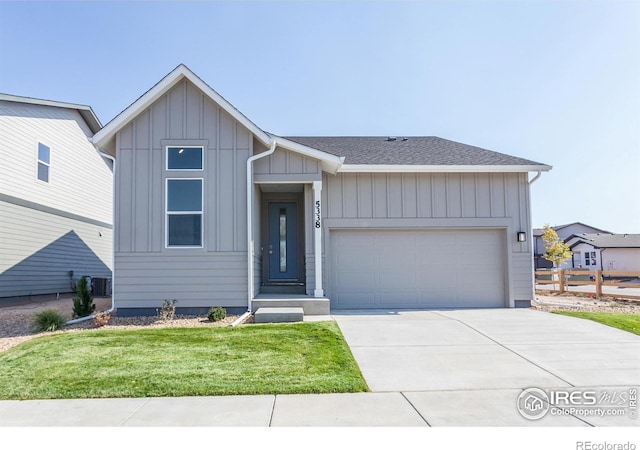 view of front of property with a garage and a front yard