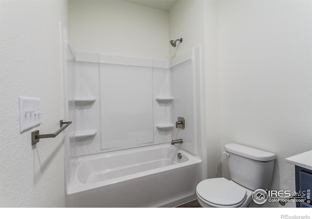 full bathroom with vanity, washtub / shower combination, and toilet