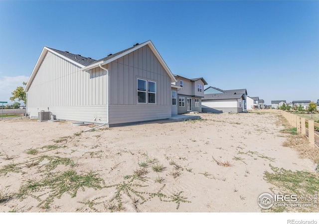 back of property featuring central AC unit