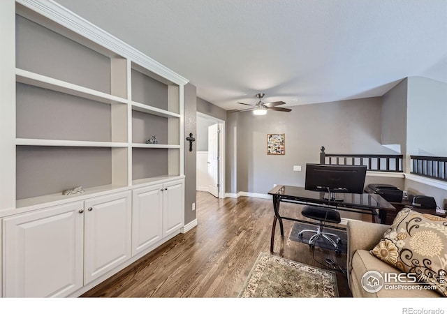 living room with ceiling fan and dark hardwood / wood-style flooring