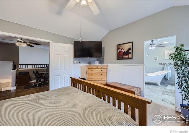 bedroom featuring ceiling fan, hardwood / wood-style flooring, and vaulted ceiling