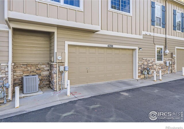 garage with central AC unit