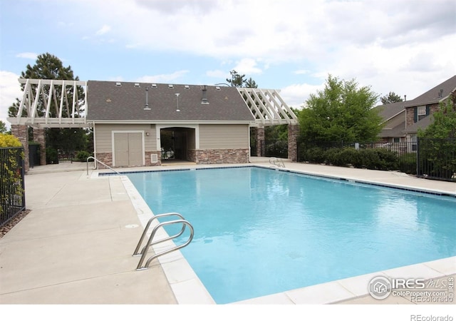 view of swimming pool featuring a patio