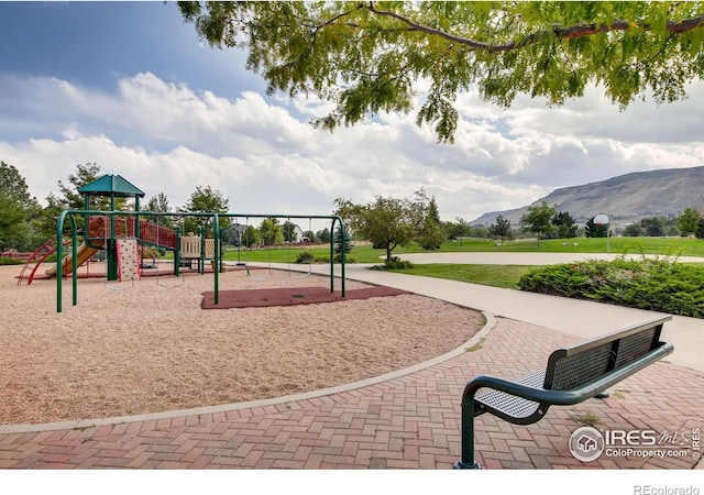 community playground featuring a mountain view