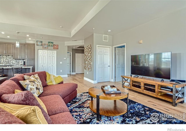 living room with light hardwood / wood-style flooring