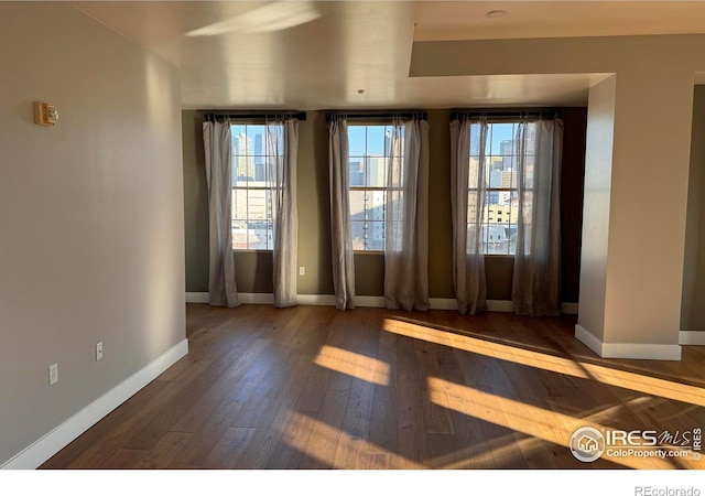 doorway to outside featuring hardwood / wood-style flooring and a healthy amount of sunlight