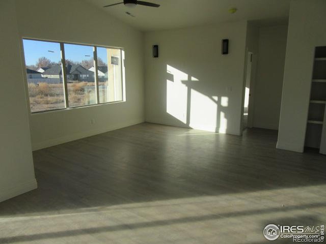 spare room with ceiling fan and lofted ceiling