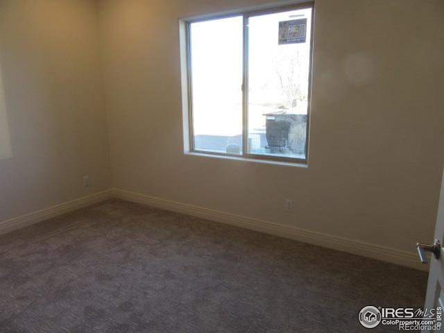 view of carpeted spare room