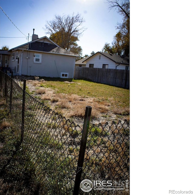 317 Second St, Roggen, CO 80652 - view of yard featuring a fenced backyard