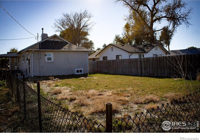 317 Second St, Roggen, CO 80652 - view of yard with a fenced backyard