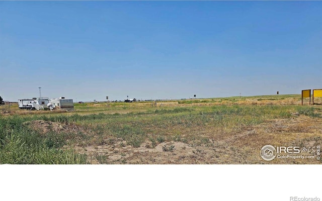 view of yard with a rural view