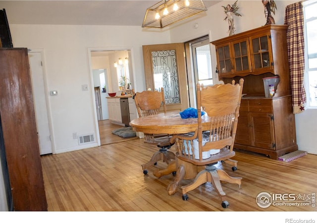 dining room with light hardwood / wood-style floors