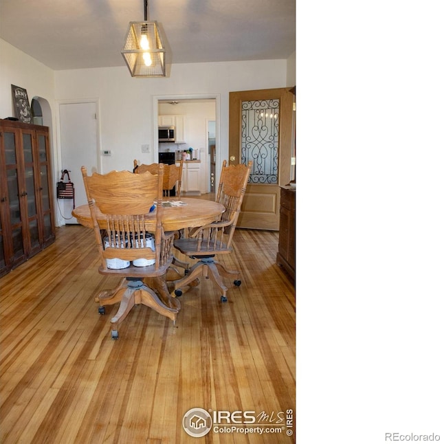 dining area with light hardwood / wood-style floors