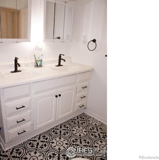 bathroom featuring vanity and tile patterned flooring