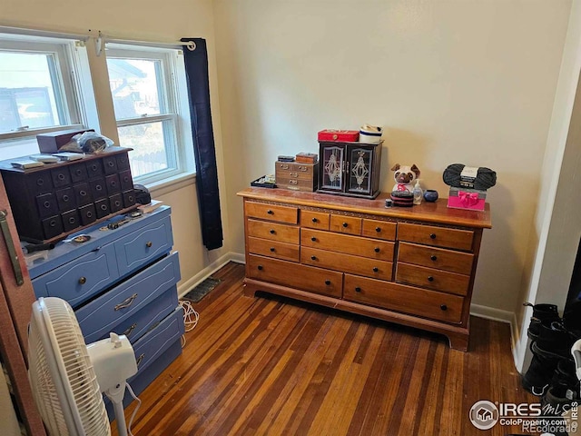 bedroom featuring dark hardwood / wood-style flooring