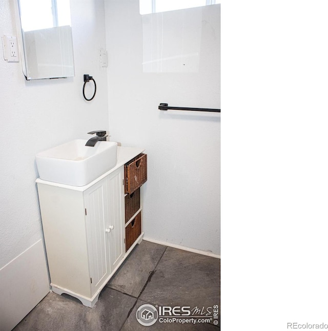 bathroom with vanity and tile patterned flooring