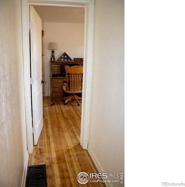 317 Second St, Roggen, CO 80652 - corridor with light wood-style flooring, baseboards, and visible vents