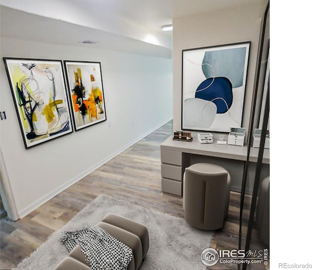 317 Second St, Roggen, CO 80652 - corridor with baseboards and wood finished floors