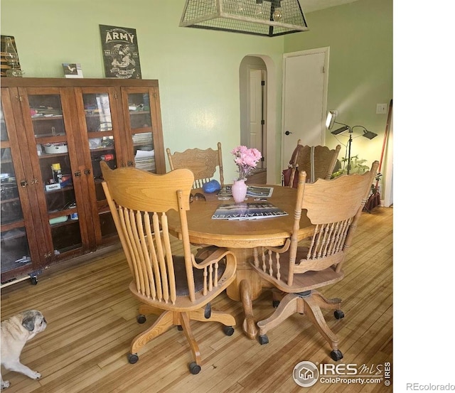 317 Second St, Roggen, CO 80652 - dining space with arched walkways and wood finished floors