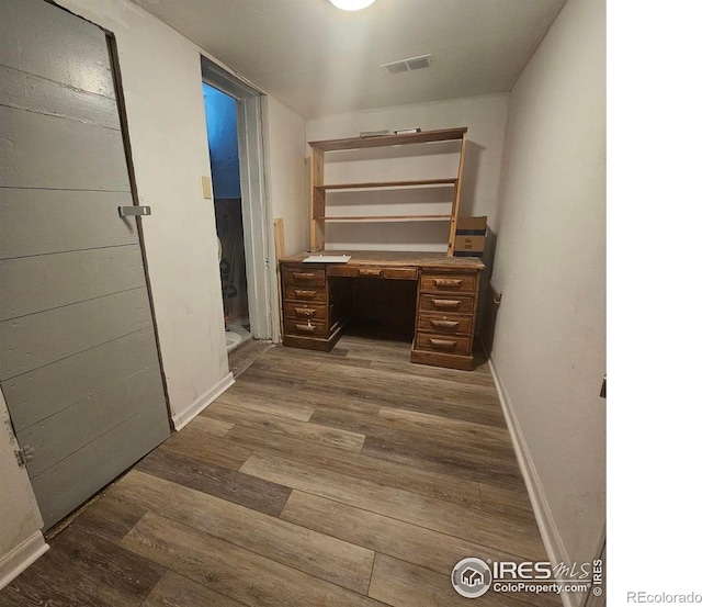 317 Second St, Roggen, CO 80652 - hall featuring baseboards and wood finished floors