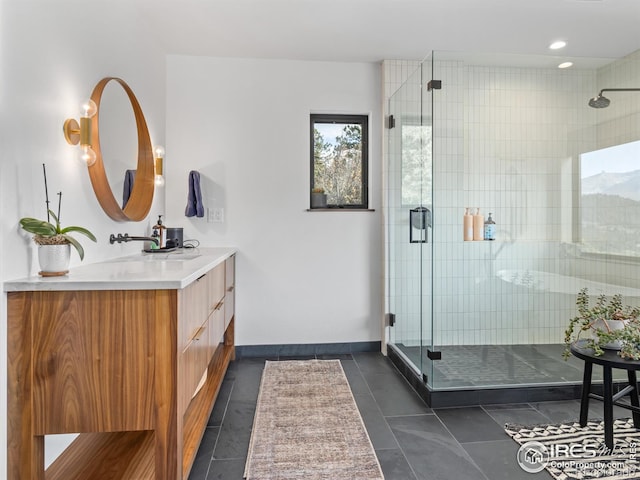 bathroom featuring vanity, tile patterned floors, and a shower with shower door