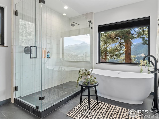 bathroom featuring separate shower and tub and tile patterned floors