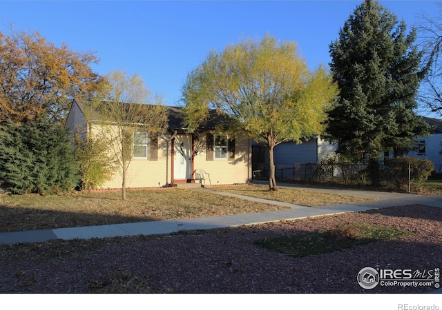 916 Ensign St, Fort Morgan, CO 80701 - obstructed view of property with concrete block siding