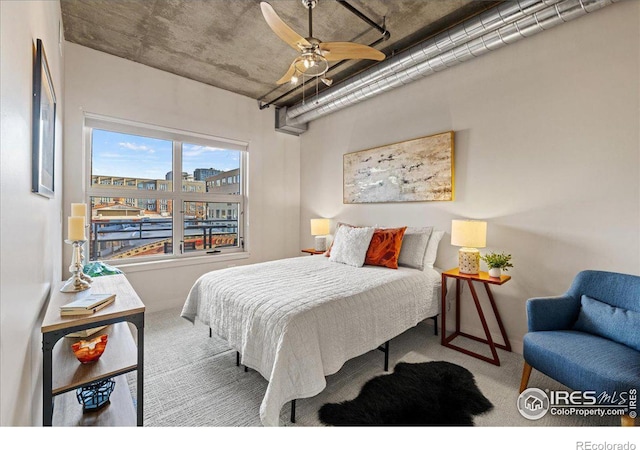 bedroom featuring light carpet and ceiling fan