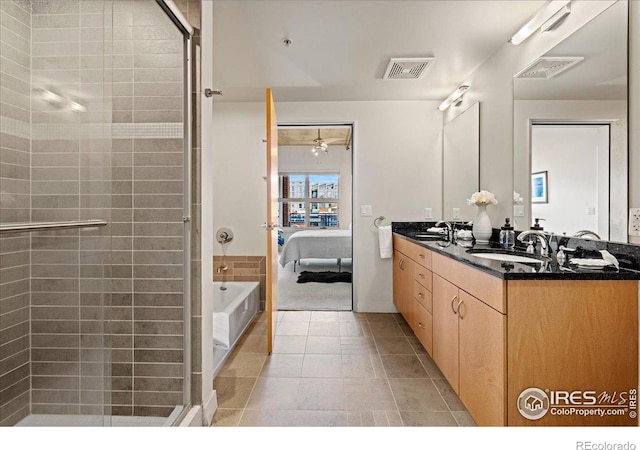 bathroom with separate shower and tub, vanity, ceiling fan, and tile patterned floors