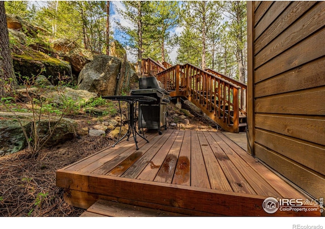 743 Hickory Dr, Lyons, CO 80540 - wooden deck featuring stairs and a grill
