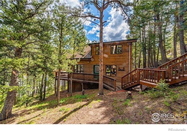743 Hickory Dr, Lyons, CO 80540 - rear view of house with a wooden deck and stairway