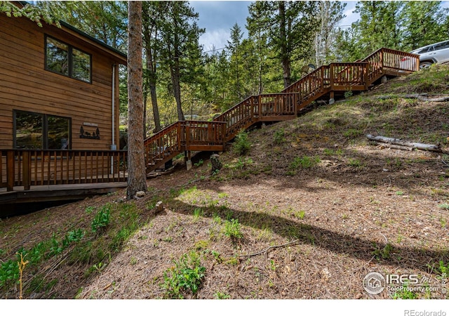 743 Hickory Dr, Lyons, CO 80540 - view of yard featuring stairway and a deck