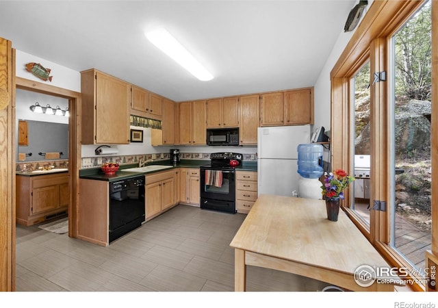 743 Hickory Dr, Lyons, CO 80540 - kitchen featuring black appliances, a sink, and dark countertops