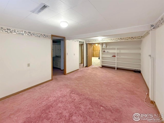 unfurnished bedroom featuring carpet, visible vents, and baseboards