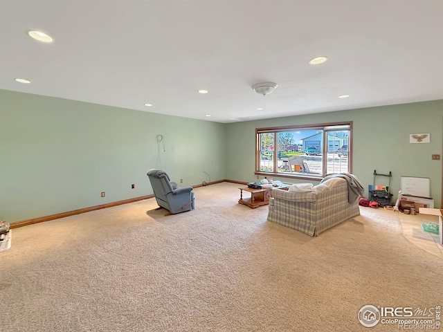 living room featuring light carpet, recessed lighting, and baseboards