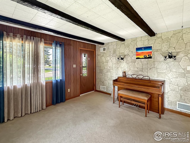 654 W Strohm St, Haxtun, CO 80731 - carpeted entryway featuring beamed ceiling and wooden walls