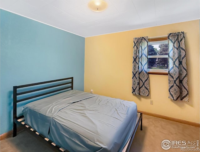 654 W Strohm St, Haxtun, CO 80731 - bedroom featuring baseboards and carpet floors