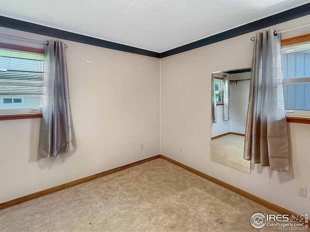 654 W Strohm St, Haxtun, CO 80731 - empty room featuring healthy amount of natural light and carpet
