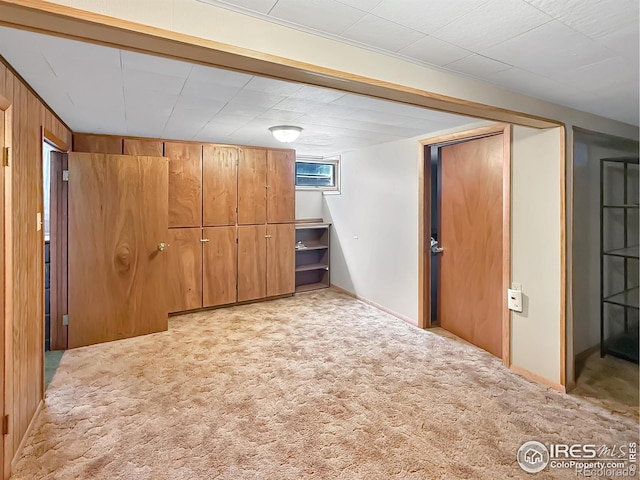 654 W Strohm St, Haxtun, CO 80731 - basement featuring light carpet and wooden walls