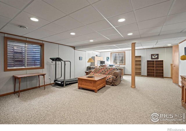 carpeted living area with recessed lighting, a paneled ceiling, and baseboards