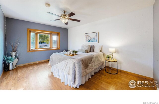 bedroom featuring ceiling fan and light wood-type flooring