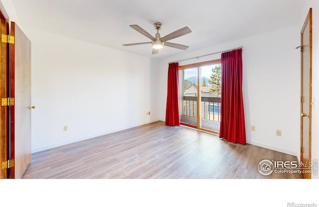 unfurnished room with ceiling fan and light hardwood / wood-style floors