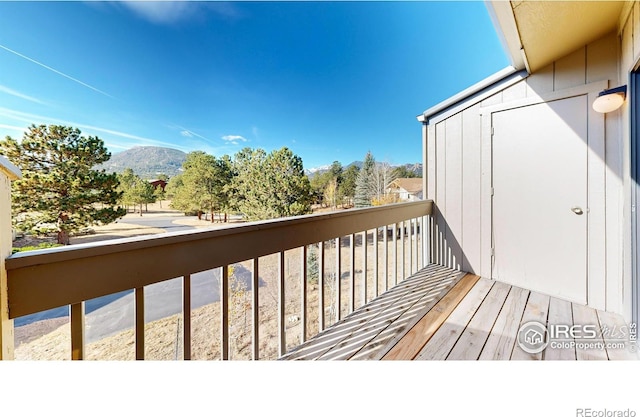 wooden deck featuring a mountain view