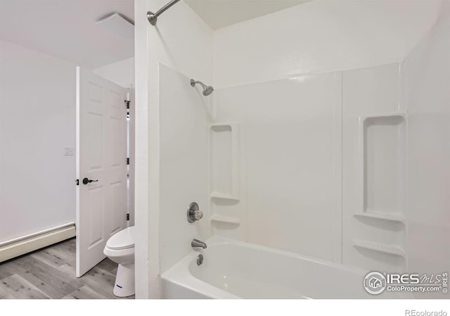 bathroom with hardwood / wood-style flooring, a baseboard radiator, shower / bathing tub combination, and toilet