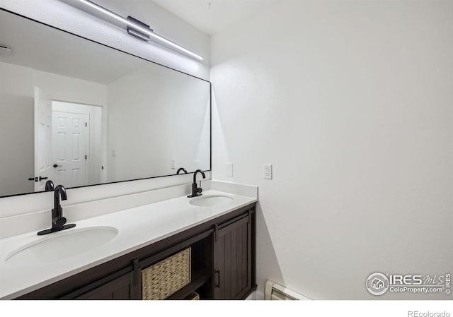 bathroom featuring vanity and a baseboard heating unit